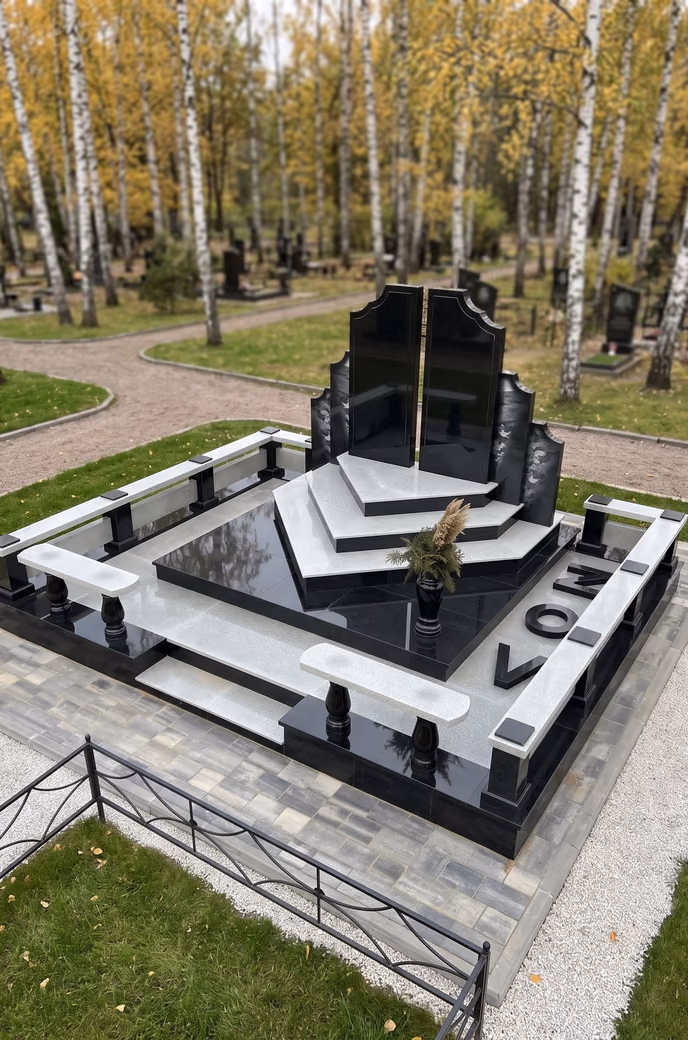 Мемориальный комплекс из чёрного и серого гранита со ступенчатым постаментом, скамьями и бордюром после установки